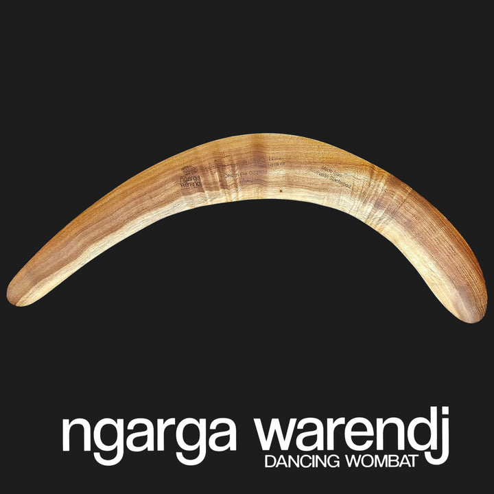 Wooden boomerang on a black background with 'ngarga warendj' branding.