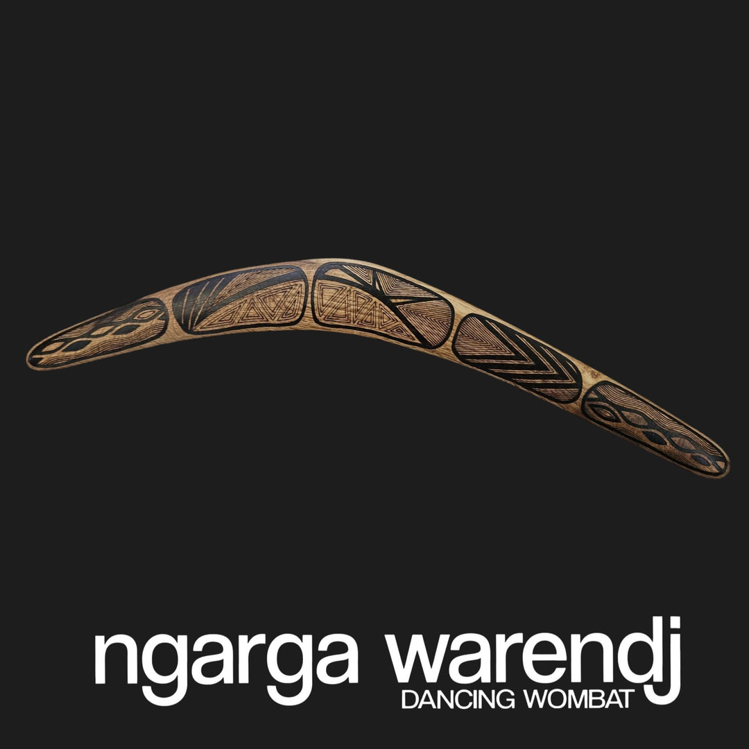 Decorative boomerang with tribal patterns on a black background, featuring the brand 'ngarga warendj'.