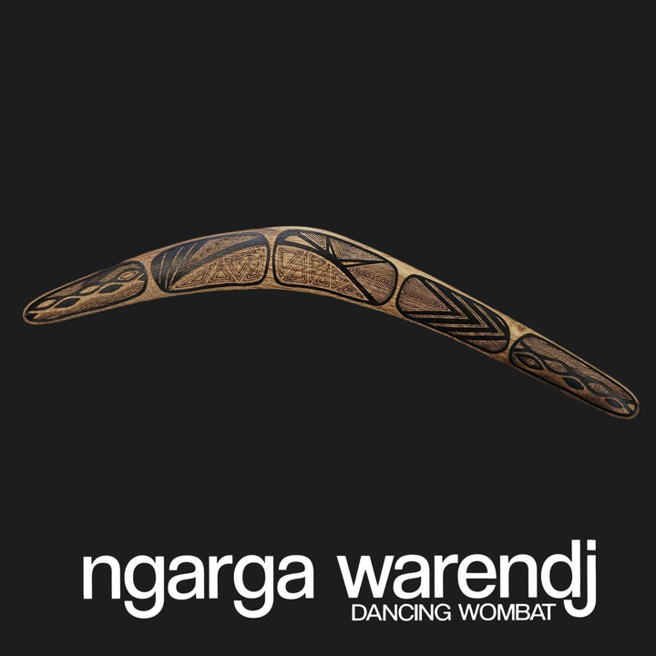 Decorative boomerang with tribal patterns on a black background, featuring the brand 'ngarga warendj'.