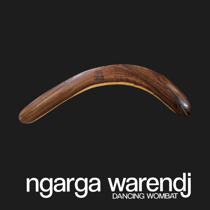 Wooden boomerang on a black background with 'ngarga warendj' branding.