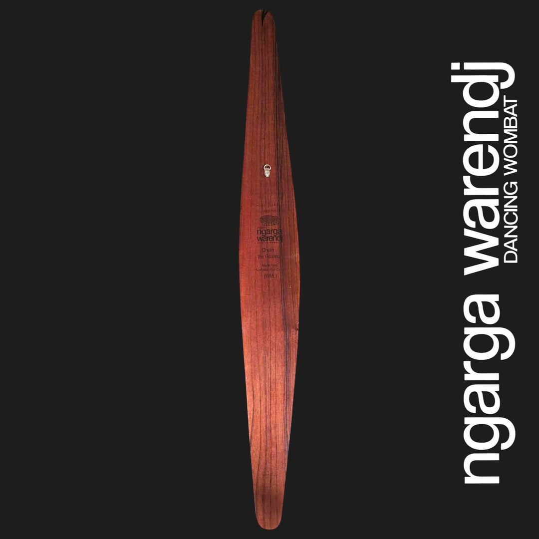 Back of large Dhulin Goanna wall shield showing red cedar grain, engraved Ngarga Warendj branding and metal wall hanger.