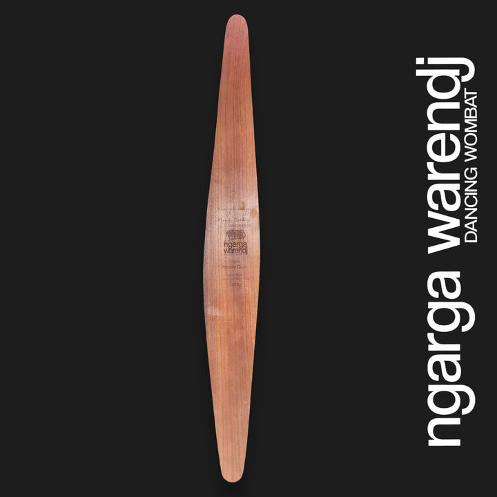 Back of large Gugra Possum Cloak wall shield showing Australian Red Cedar grain and engraved Ngarga Warendj branding.
