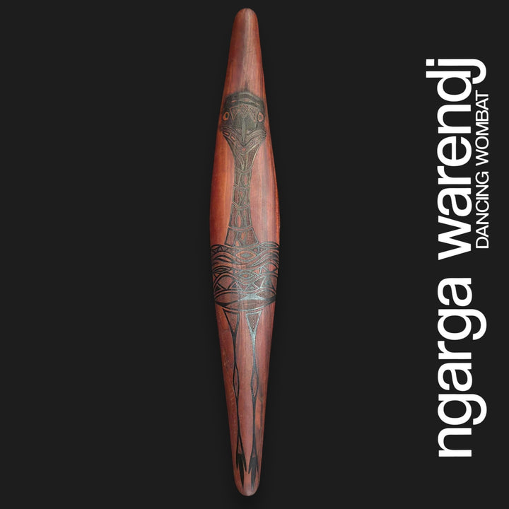 Front of large wide red cedar wall shield featuring Barramul the emu with patterned body, long neck and legs.