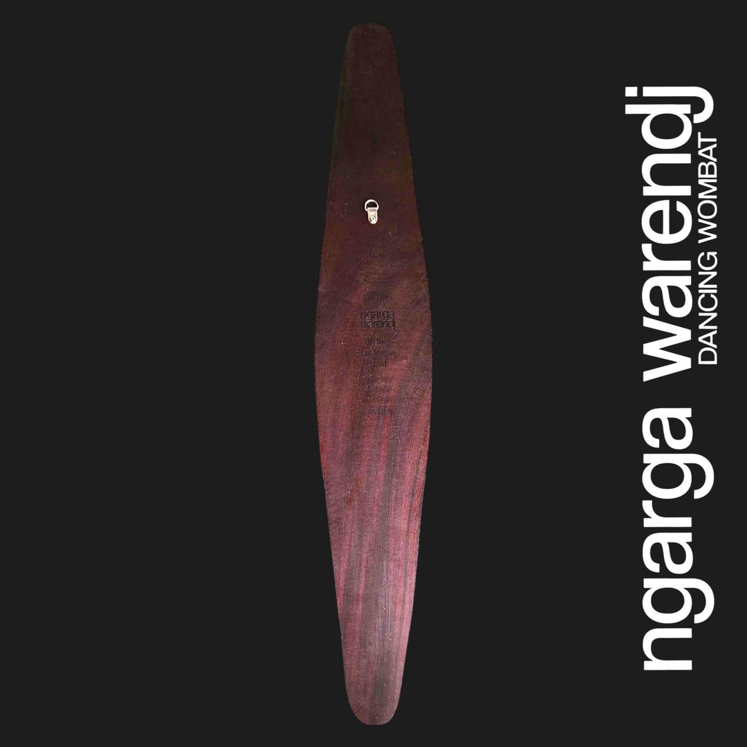 Back of medium Dhulin Goanna wall shield showing red cedar grain, engraved branding and an attached metal wall hanger.