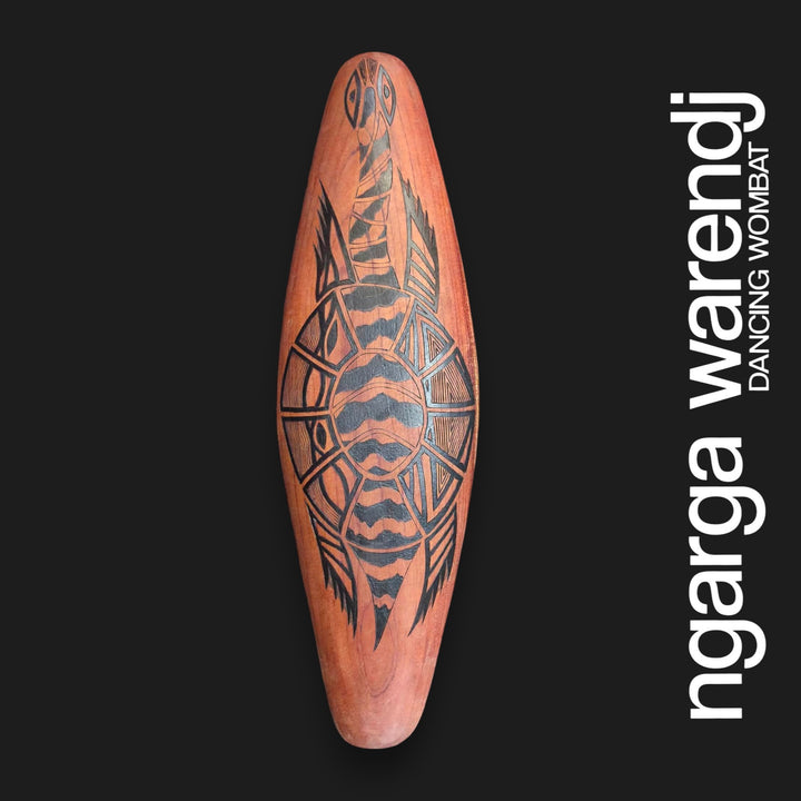 Front of small wide Australian Red Cedar wall shield featuring Barebin Buk, the long-necked turtle, with black patterned shell and limbs.