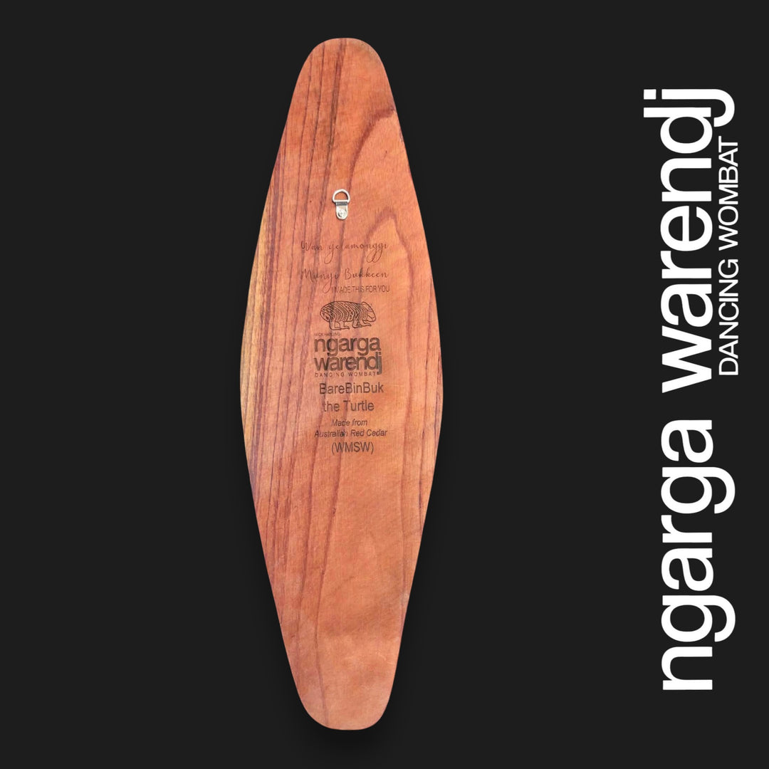 Back of small wide Barebin Buk Turtle wall shield showing Australian Red Cedar grain, engraved information and an attached wall hanger.