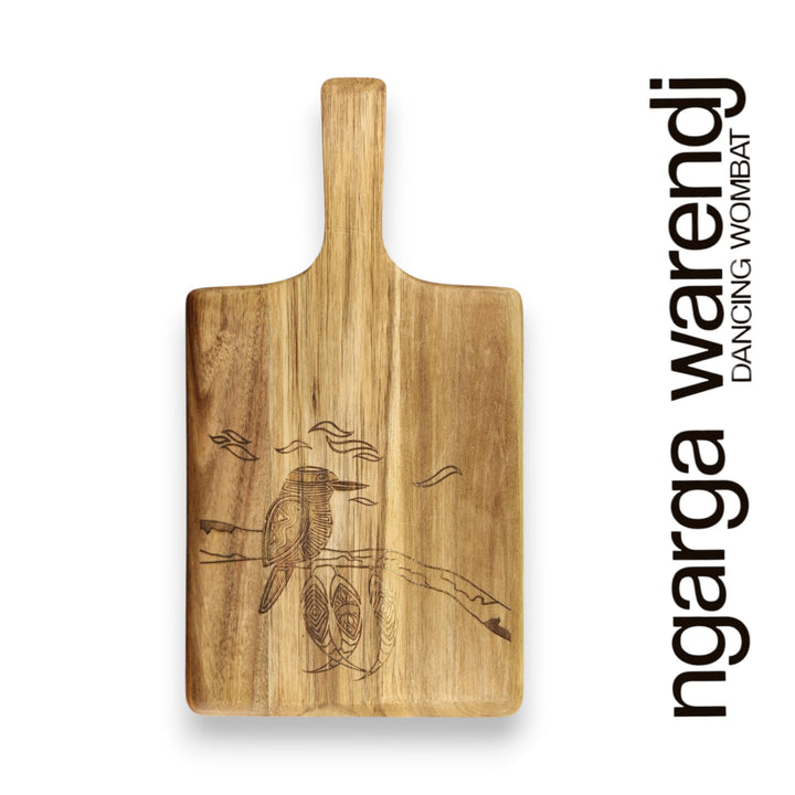 Wooden cutting board with engraved design on a white background, featuring the brand 'ngarga warendj'.