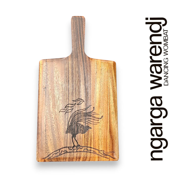 Wooden cutting board with engraved design on a white background, featuring the brand 'ngarga warendj'.