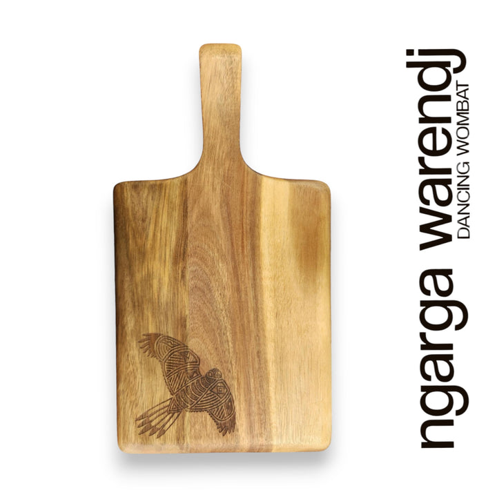 Wooden cutting board with an eagle design on a white background, featuring the brand 'ngarga warendj'.