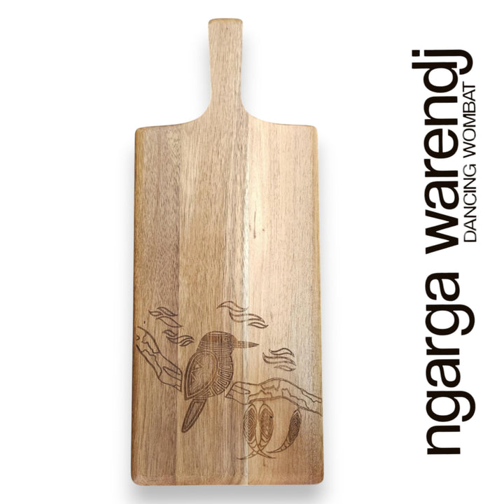 Wooden cutting board with engraved design on a white background, featuring the brand 'ngarga warendj'.