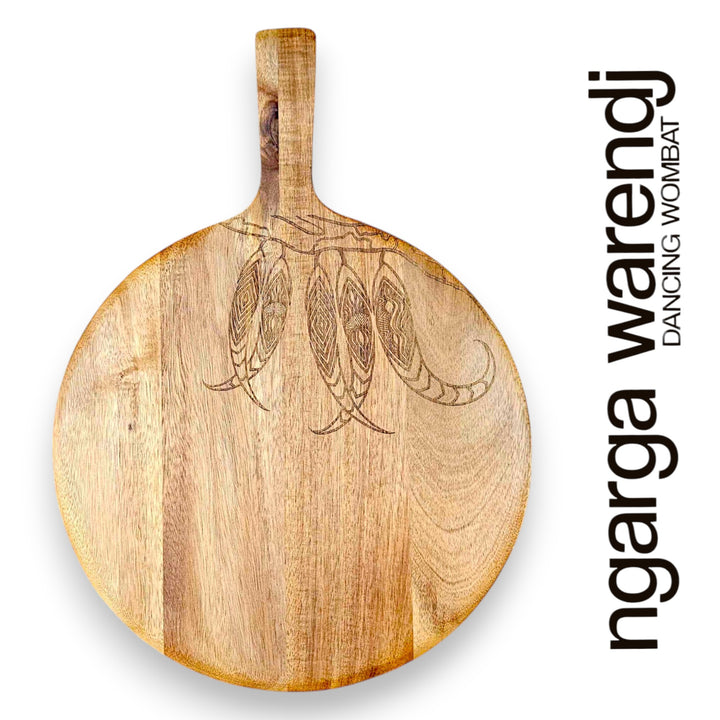 Wooden paddle with engraved design on a white background, featuring the brand 'ngarga warendj'.