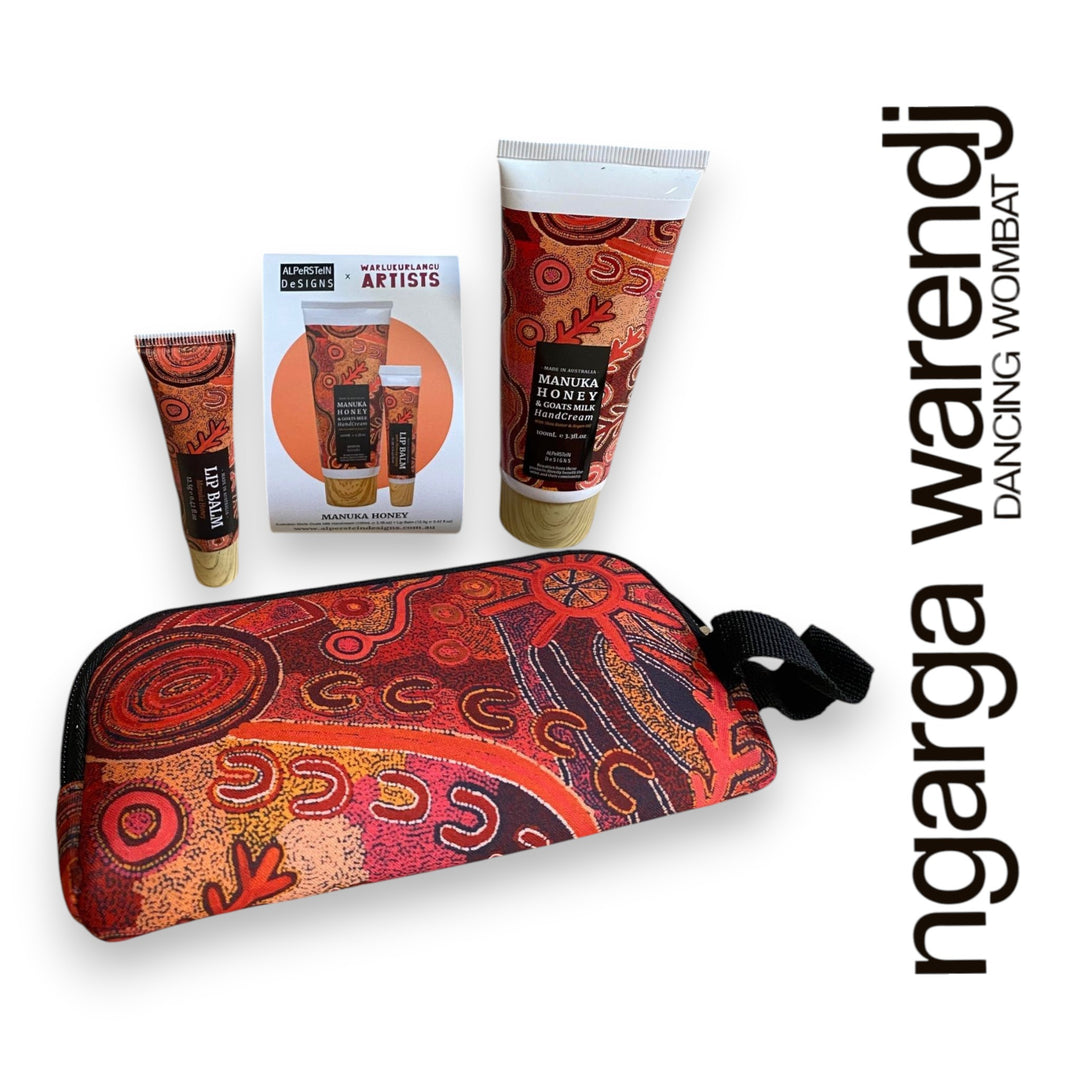 Gift box with various items including a pouch with hand cream and lip balm , hand and body wash, chocolate and card, branded 'ngarga warendj'.