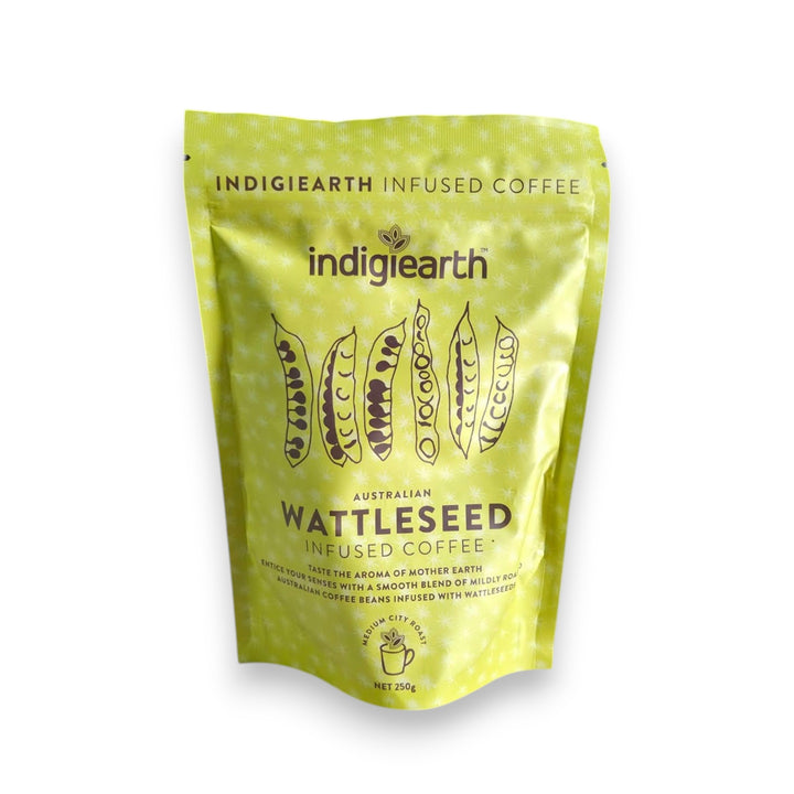 A stand-up pouch of Indigiearth Wattleseed Infused Coffee in a bright yellow-green color, featuring illustrations of wattleseed pods and product details on a white background.