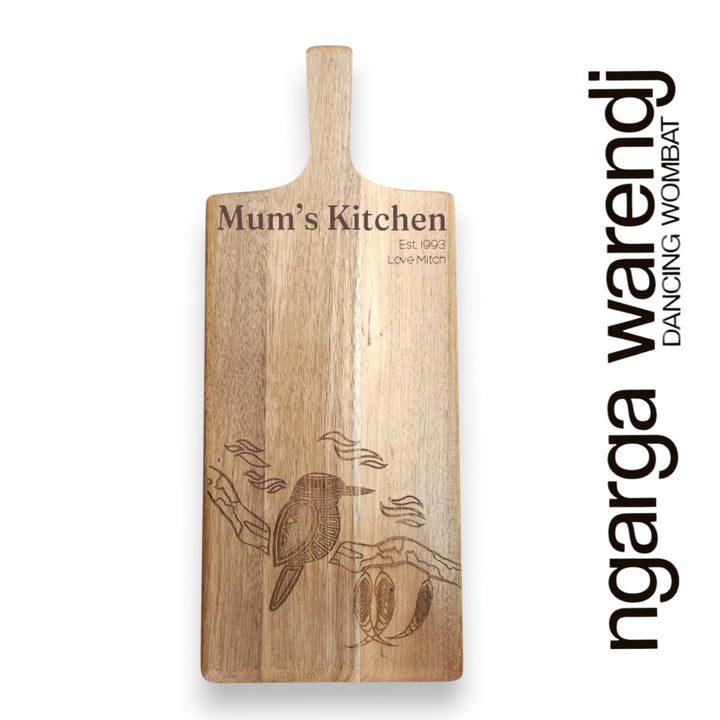 Wooden cutting board with engraved design and text on a white background, featuring the brand 'ngarga warendj'.