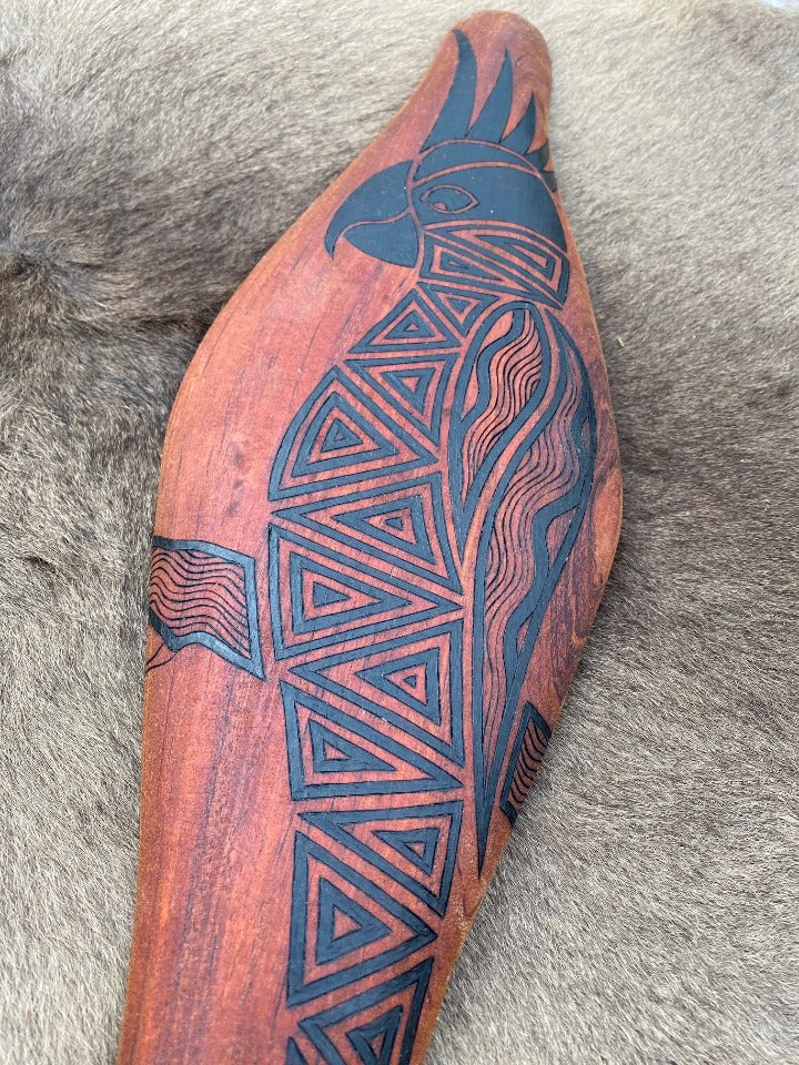 Parrying Malgarr Shield with Gaan the Cockatoo Design.    Hand crafted in Australia from Australian Red Cedar timber. All artefacts come with an information card.   The card has information about the artist, artefact and design.   All designs are based on traditional symbols from South East Australia.