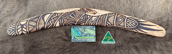 Large Bundjil the Wedge Tailed Eagle Wangim / Boomerang. Made from Stringybark timber.  Hand Crafted in Australia.  All artefacts come with an information card.  The card has information about the artist, artefact and design. All our wangim are made from timber collected from tree roots or branches that have a natural bend. All designs are based on traditional symbols from South East Australia