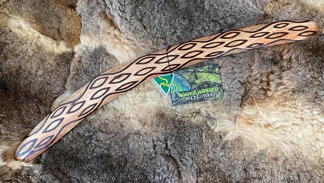 Large Barring Tracks Wangim / Boomerang. Hand Crafted in Australia by Ngarga Warendj. All our wangim are made from timber collected from tree roots or branches that have a natural bend. All designs are based on traditional symbols from South East Australia