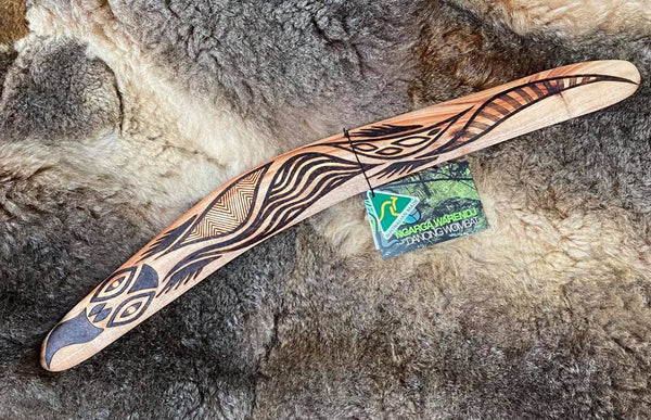 Medium Bili Bluetongue Lizard Wangim / Boomerang. Hand Crafted in Australia by Ngarga Warendj. All our wangim are made from timber collected from tree roots or branches that have a natural bend. All designs are based on traditional symbols from South East Australia
