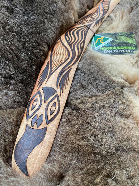 Medium Bili Bluetongue Lizard Wangim / Boomerang. Hand Crafted in Australia by Ngarga Warendj. All our wangim are made from timber collected from tree roots or branches that have a natural bend. All designs are based on traditional symbols from South East Australia