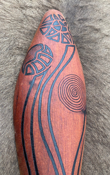 Traditionally malgarr ( shields ) were used with liyangayil ( fighting clubs) for hand to hand combat with our enemies. I have replicated the shape ofthese shields in my artwork. The Kwambee djak or common tree fern was used as a staple food by our old people during the Warendj (wombat season) or cooler months. Handcrafted in Australia from Australian Red Cedar by Mick Harding Ngarga Warendj Dancing Wombat