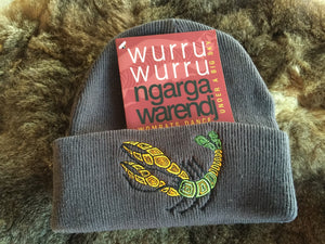 Ngarga Warendj Slate Grey Beanie with Embroidered Green & Yellow Yabby Design   Bunggan Gulum the Yabby lives in wetlands, rivers, creeks, dams   and waterways. He builds his mud brick home for protection from   the elements and from predators.  He makes very good tucker   when boiled up.  